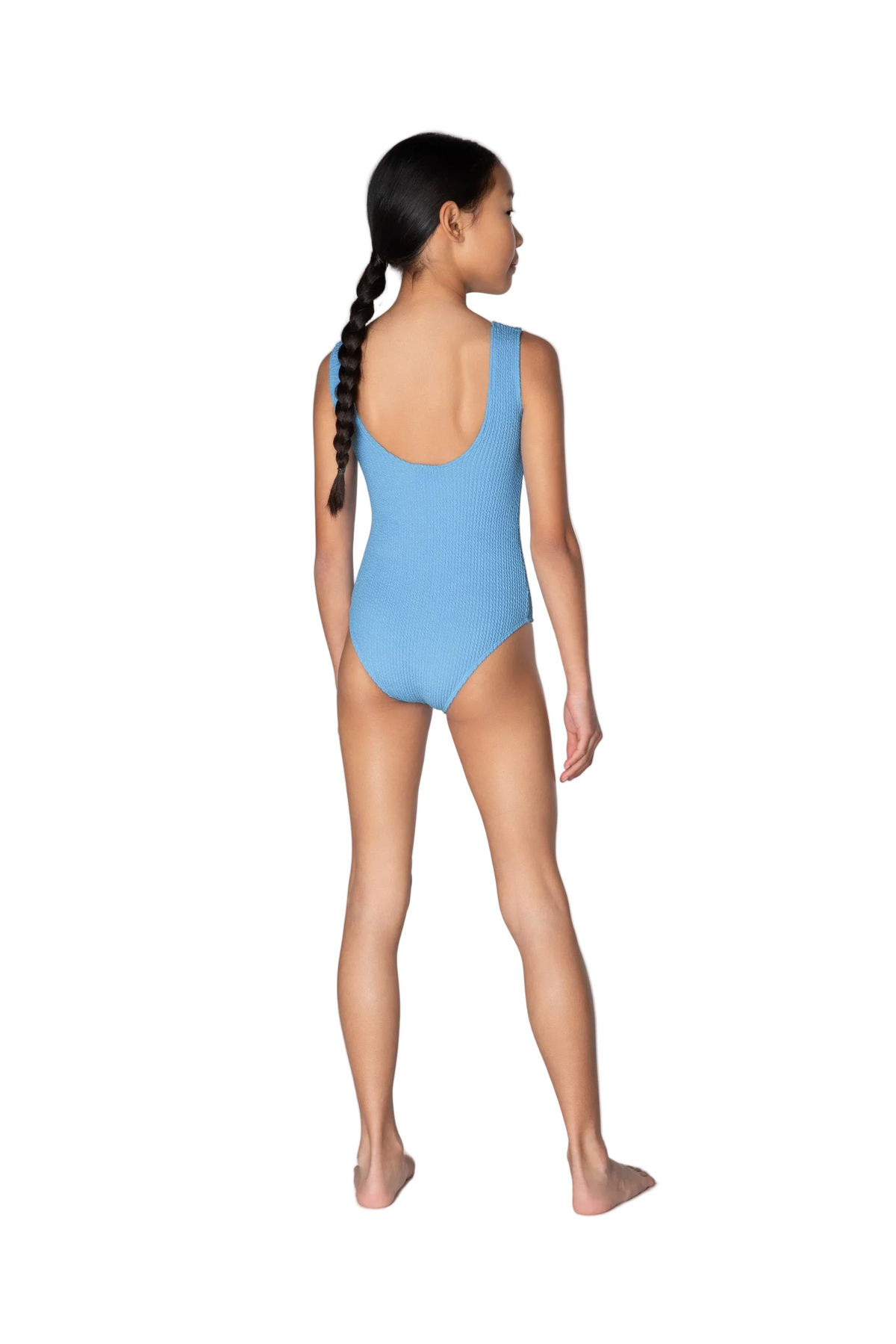 Woman wearing a light blue swimsuit on a white background
