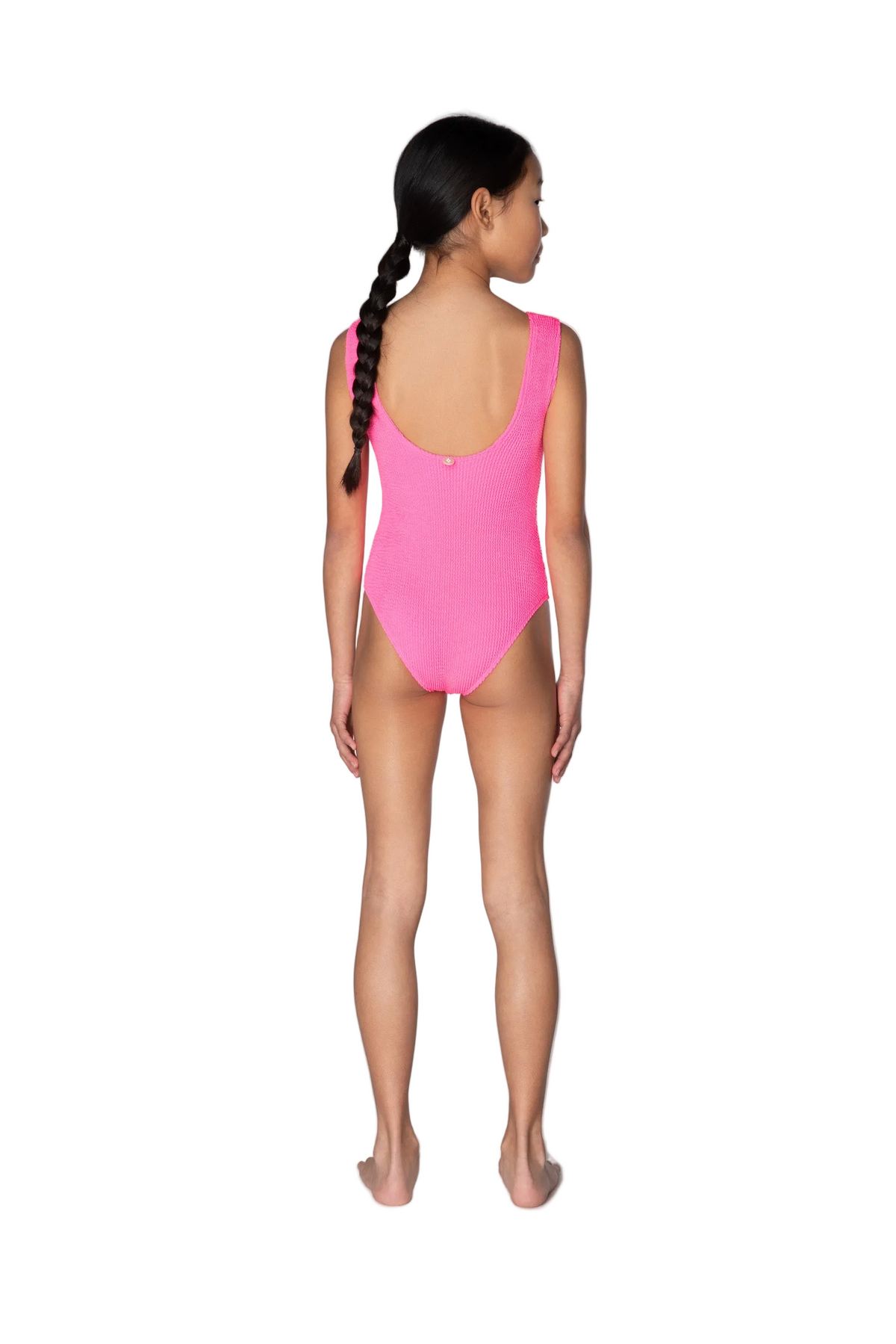Person wearing a bright pink swimsuit on a white background