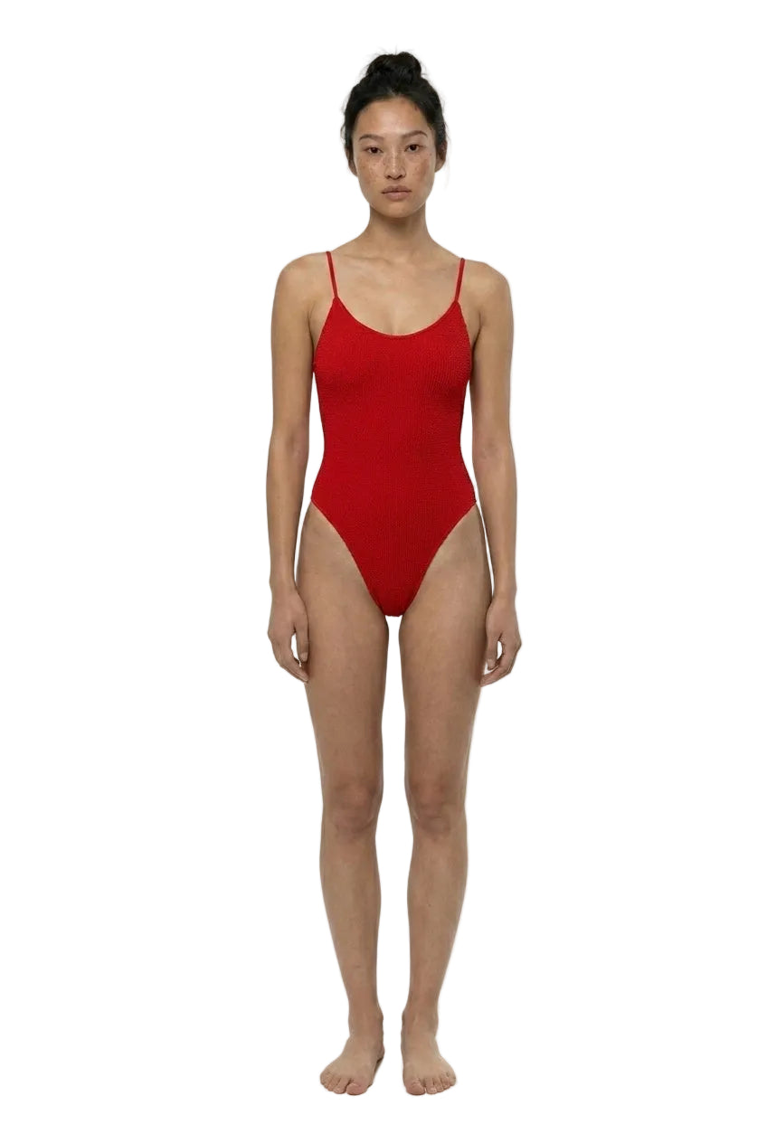 Person wearing a red swimsuit on a white background