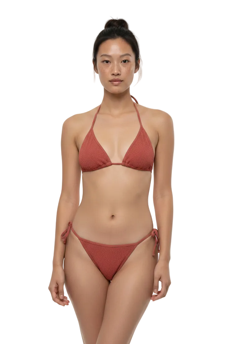 Woman wearing a red bikini on a white background